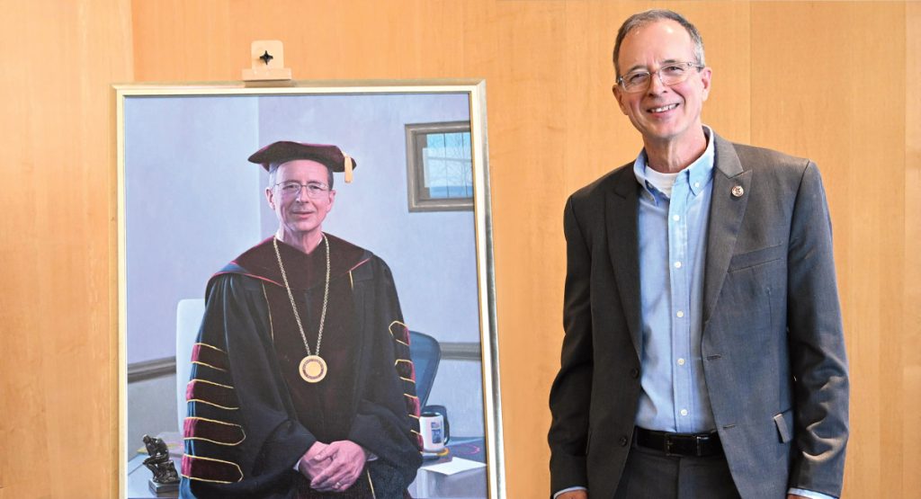 Dr. Wight next to his portrait
